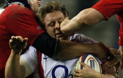 England's Wilkinson is tackled by Wales's Popham and Jones during Six Nations rugby union match at Twickenham in London